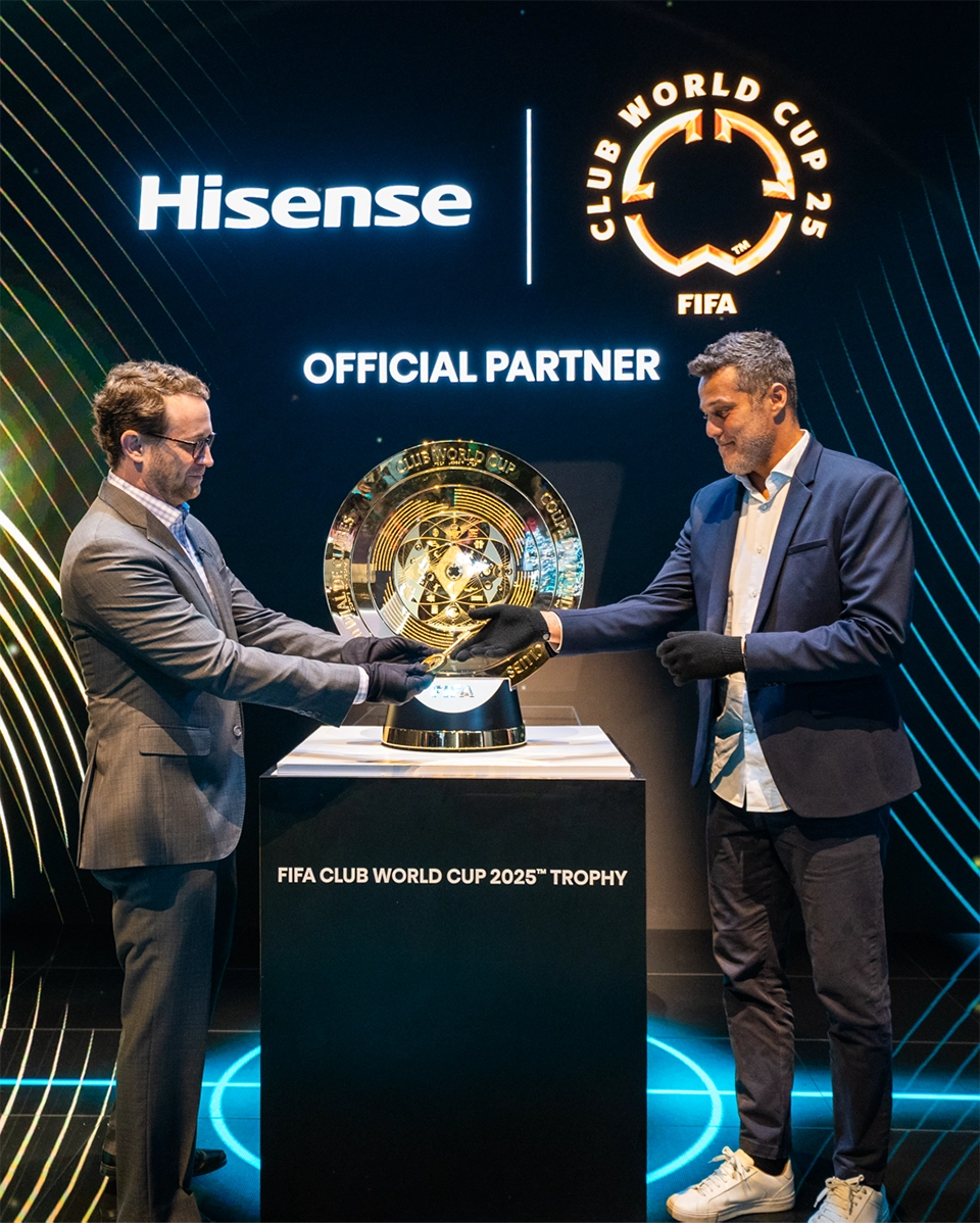 Photo Captions: David Gold, Vice President of Hisense International and President of Hisense Americas and Aldo Kafie, Head of FIFA Partnership Management, unveil the FIFA Club World Cup 2025™ Trophy at CES